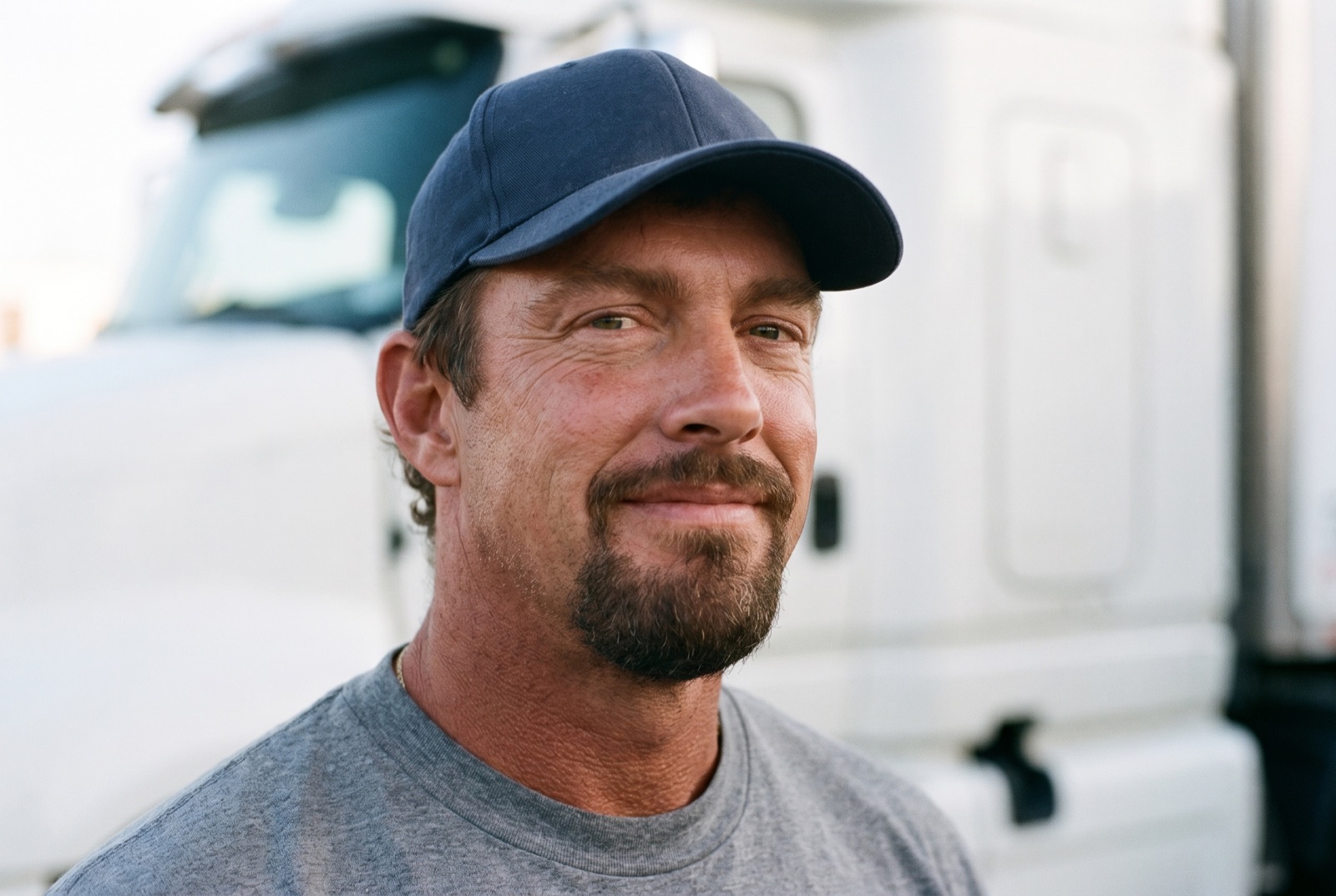 Owner-operator beside his truck